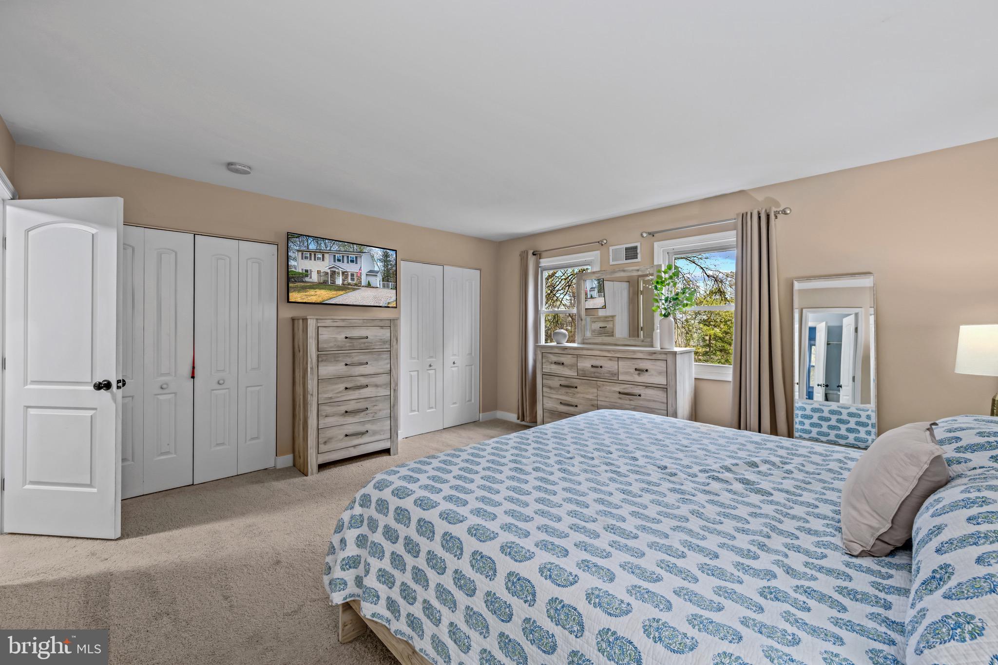 129 McKinsey Road Severna Park, MD 21146 - Photo 25 of 38 a bedroom with a large bed and a closet