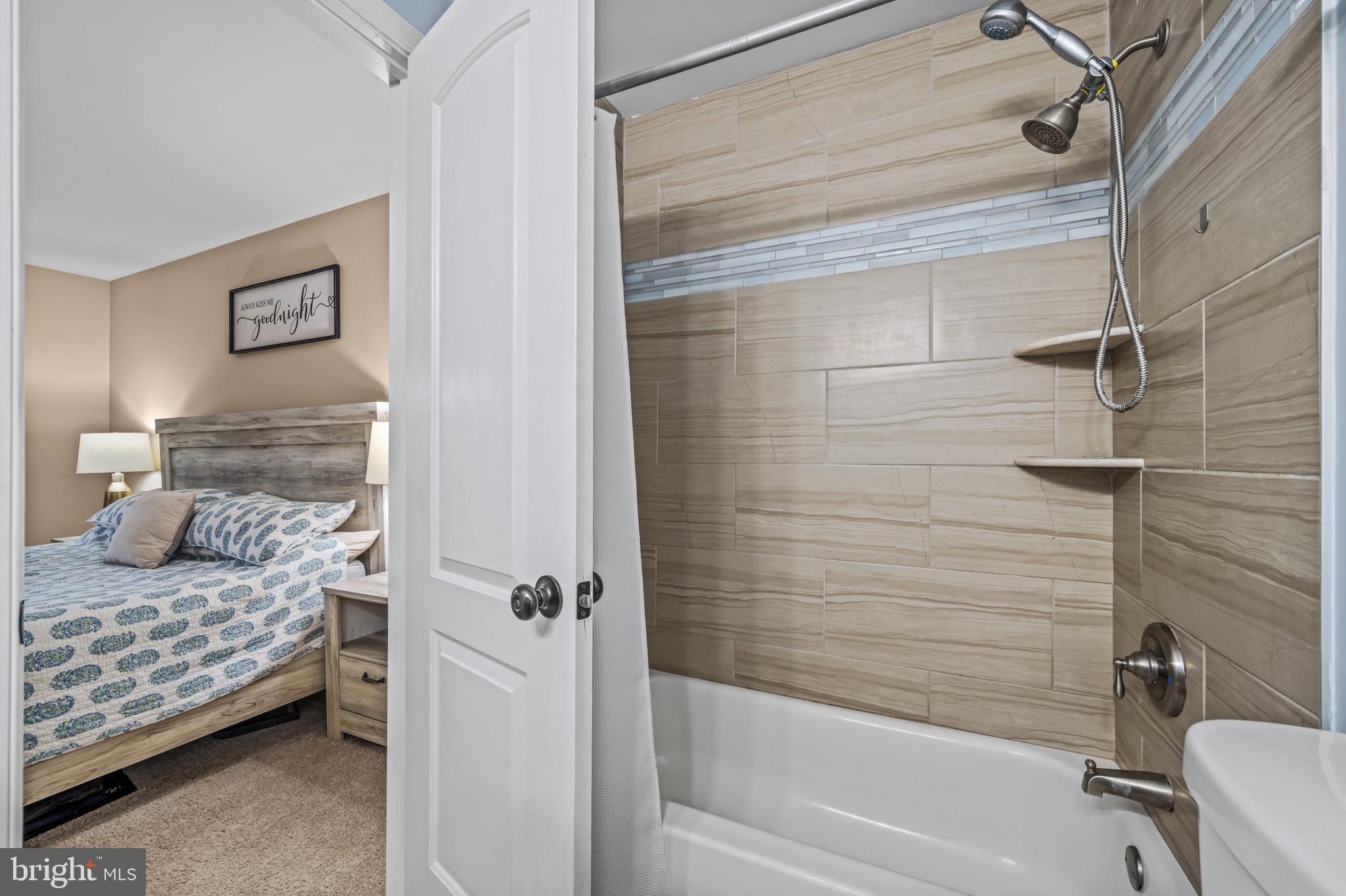 129 McKinsey Road Severna Park, MD 21146 - Photo 27 of 38 a bathroom with a bathtub and shower