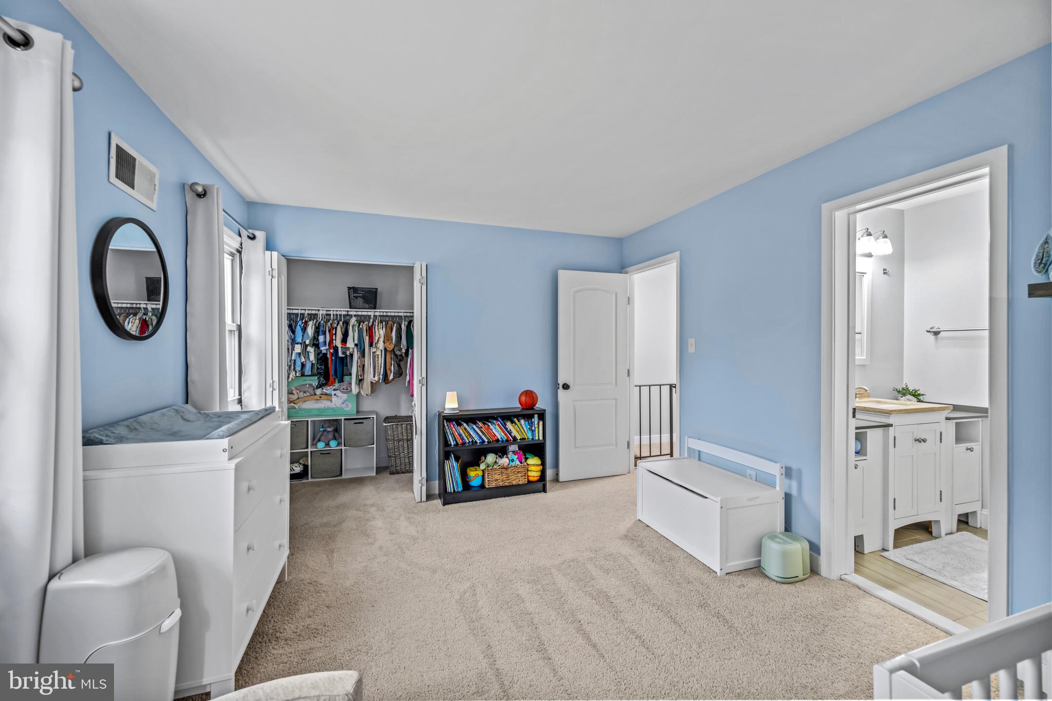129 McKinsey Road Severna Park, MD 21146 - Photo 29 of 38 a living room with furniture and a baby crib