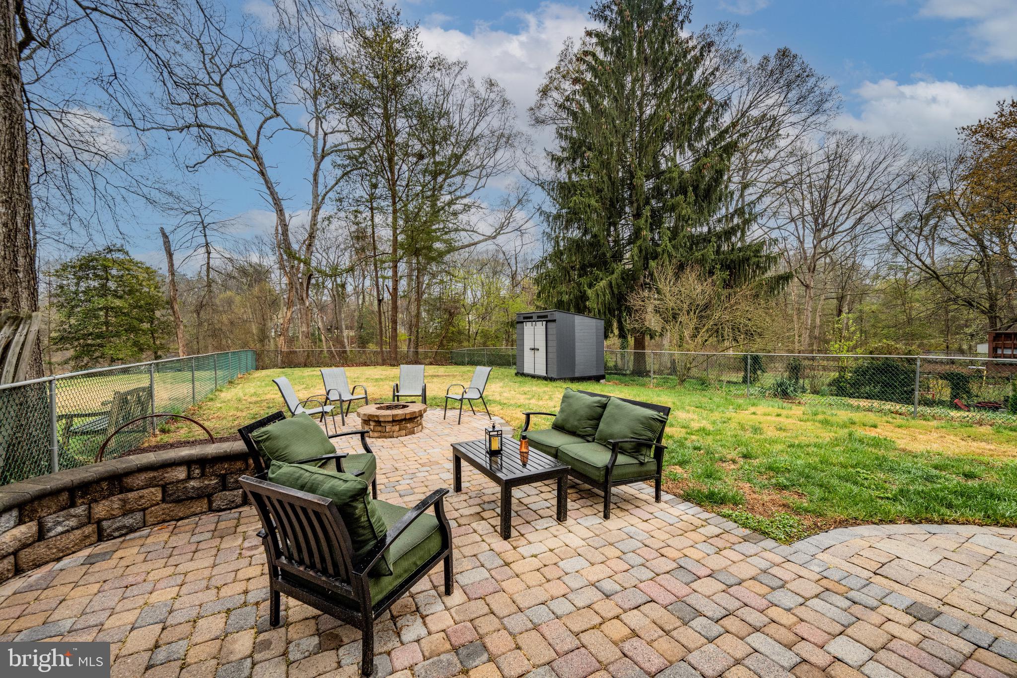 129 McKinsey Road Severna Park, MD 21146 - Photo 4 of 38 a view of backyard with seating space and trees