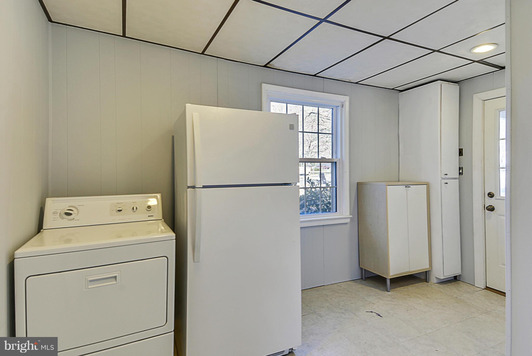 1597 Kimblewick Road Potomac, MD 20854 - Photo 14 of 30 a utility room with dryer and washer