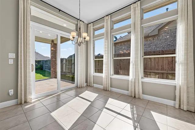 a bathroom with a glass shower door and a glass door