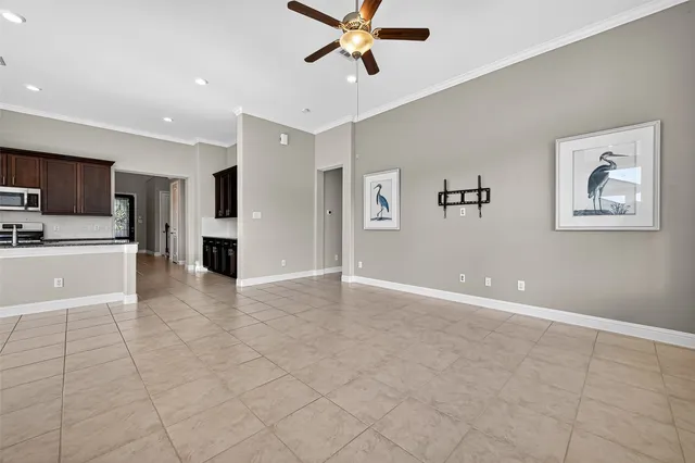 a view of kitchen with windows and refrigerator