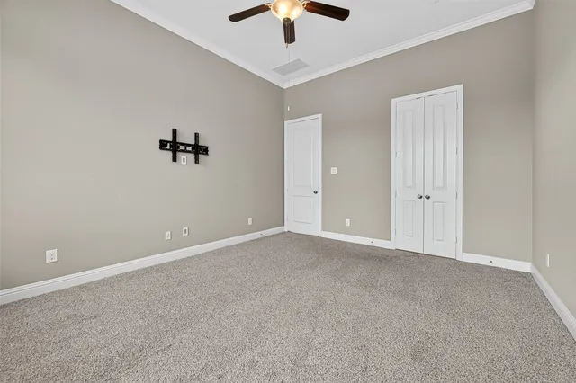 a spacious bathroom with a tub sink and mirror