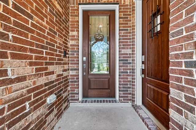 a view of a door and a window
