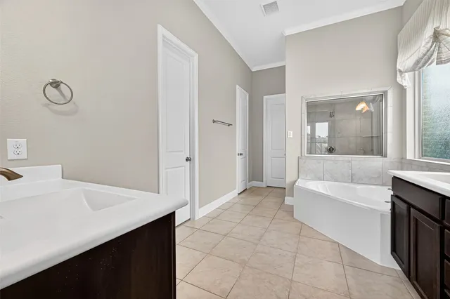 a bathroom with a bathtub and a sink