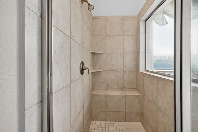 a bathroom with a toilet a sink and a mirror