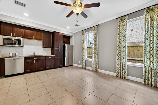 a close view of a sink and dishwasher