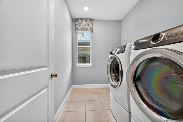 a view of staircase with railing and white walls