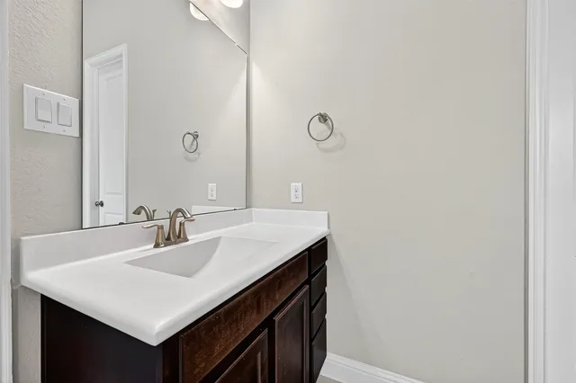 a bathroom with a bathtub and sink