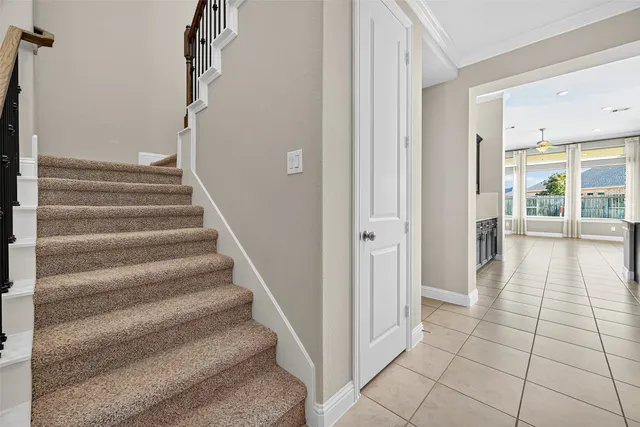 a view of an entryway with wooden floor and a living room
