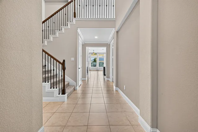 a hallway with entryway and hall