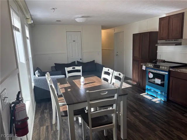 a view of a yard with a tree