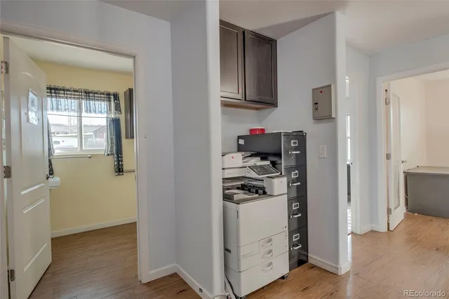 a view of kitchen cabinets and refrigerator