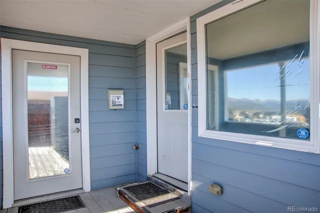 a view of front door and bedroom