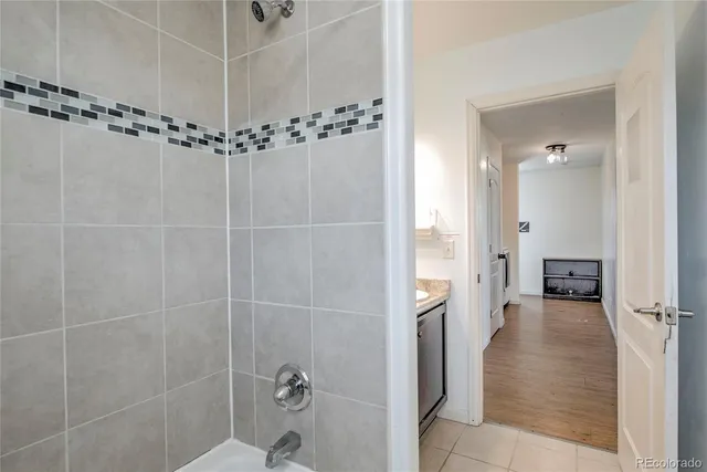 a bathroom with a glass shower door