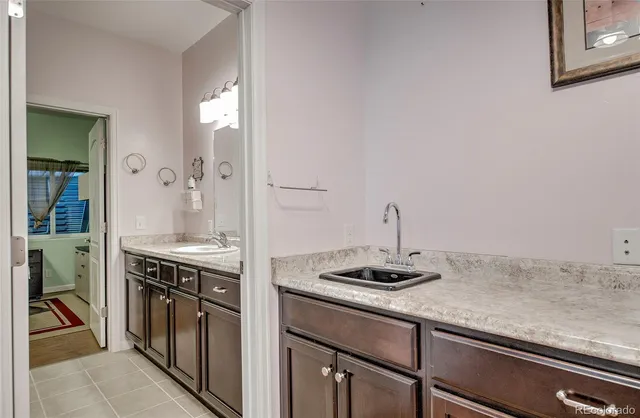 a kitchen with a sink and cabinets