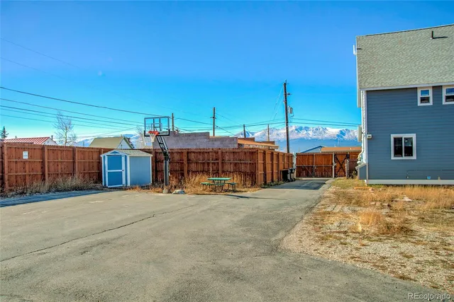 a view of a house with basket ball court