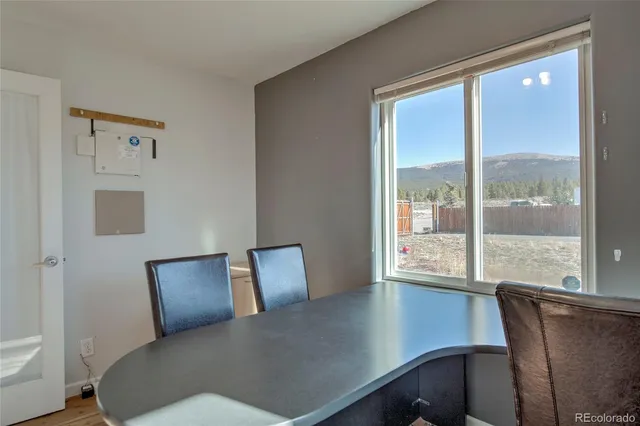 a view of a bedroom with furniture and windows