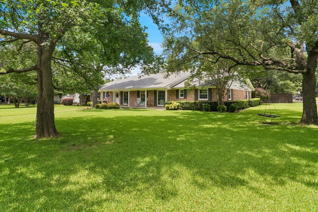 11439 Rosser Road Dallas, TX 75229 - Photo 34 of 35 a view of a house with a big yard