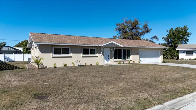 a front view of a house with garage