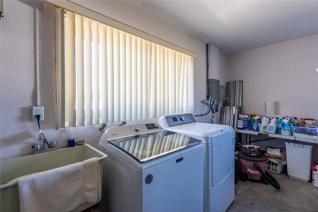 a bed sitting in a room next to a window