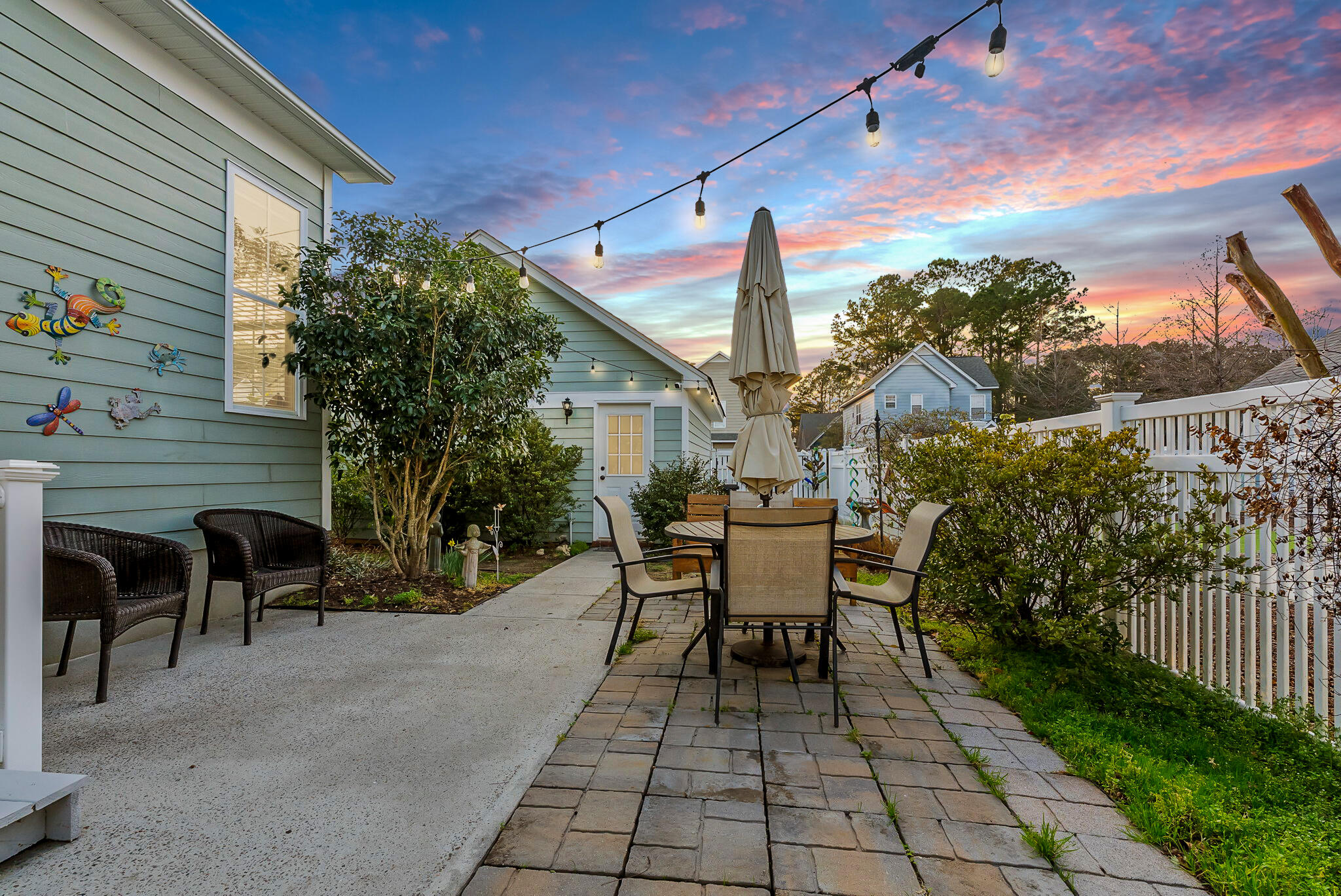 302 Hydrangea Street Summerville, SC 29483 - Photo 4 of 54 Patio dusk with lights