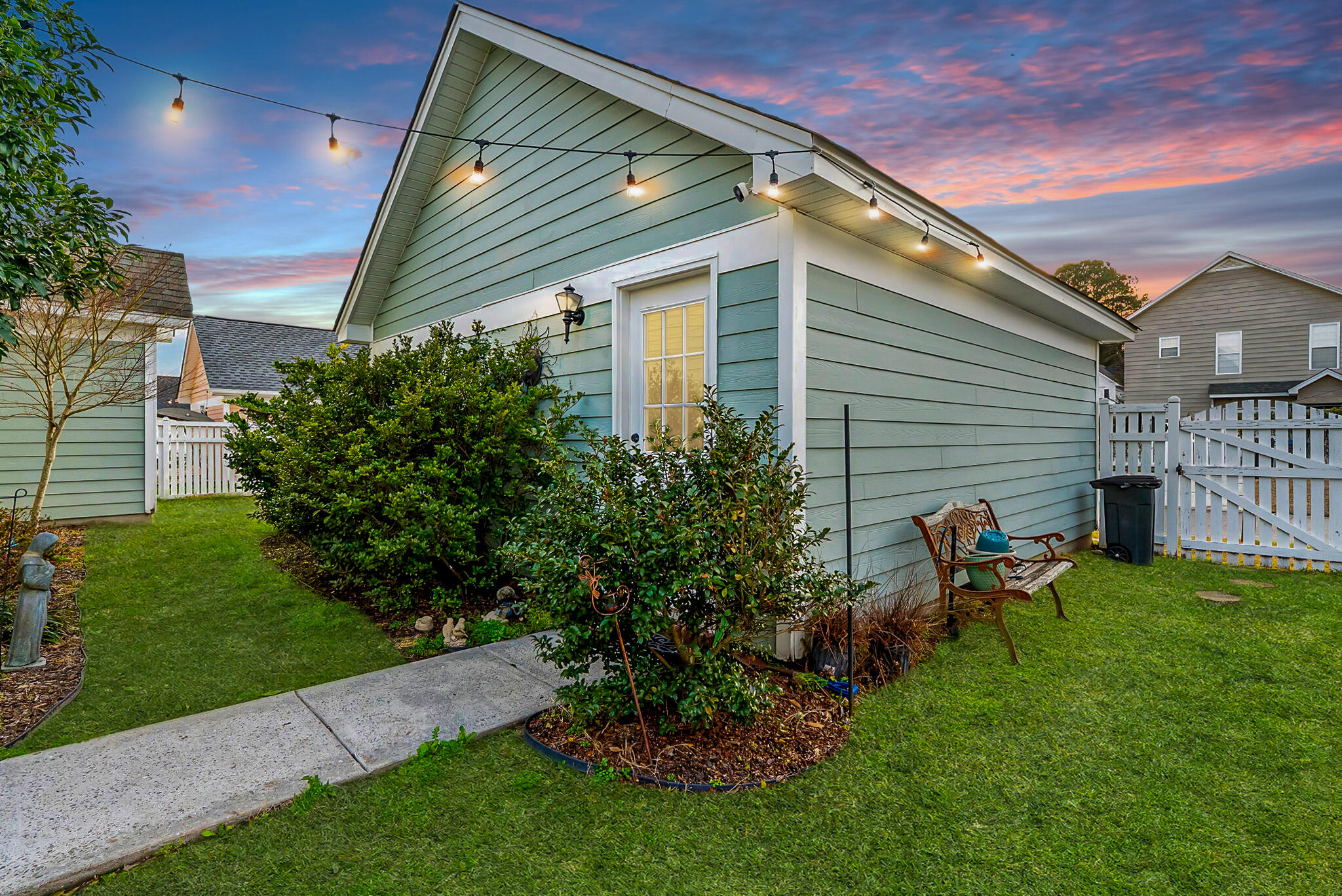302 Hydrangea Street Summerville, SC 29483 - Photo 5 of 54 Dusk back with lights