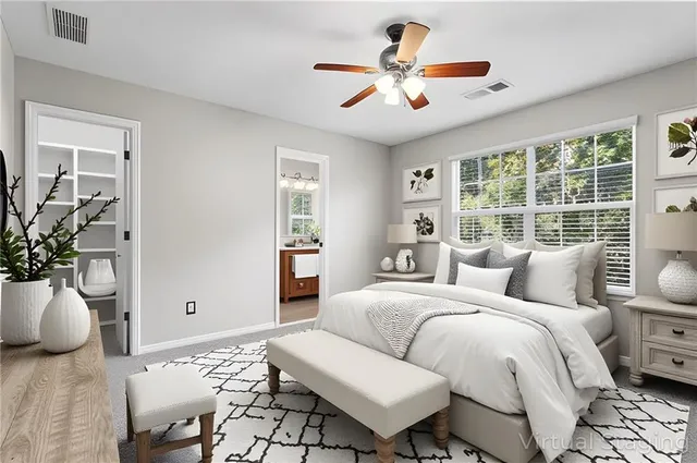 an empty room with windows and closet