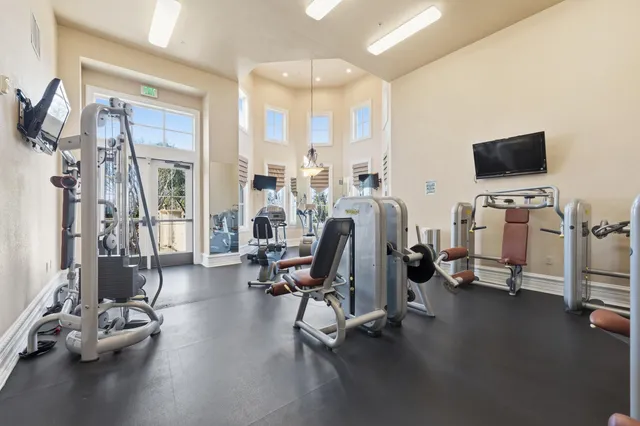 a view of a livingroom with gym equipment