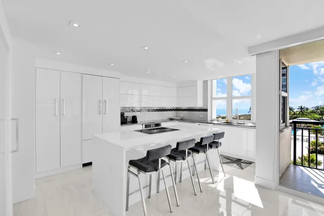 a bathroom with a shower curtain and a sink