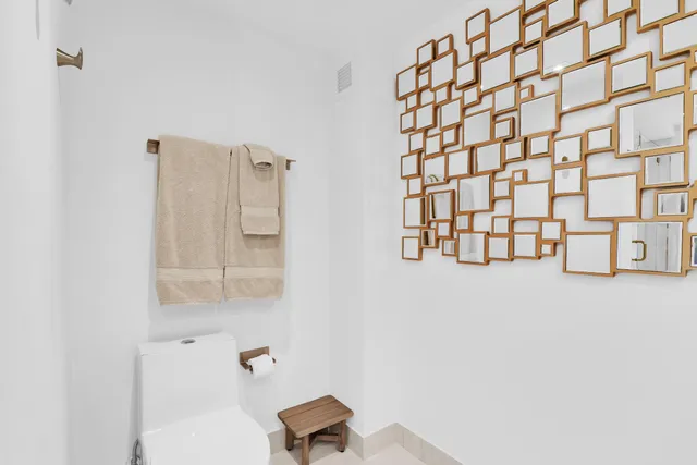 a bathroom with a glass shower door