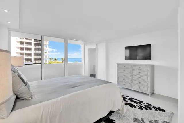 a bathroom with a toilet sink a mirror and vanity