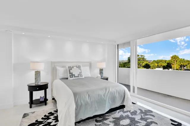 a bathroom with a sink mirror and vanity