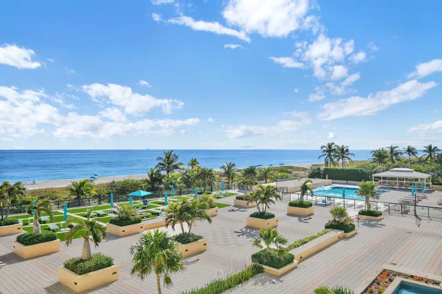 a living room with lots of furniture and a large window