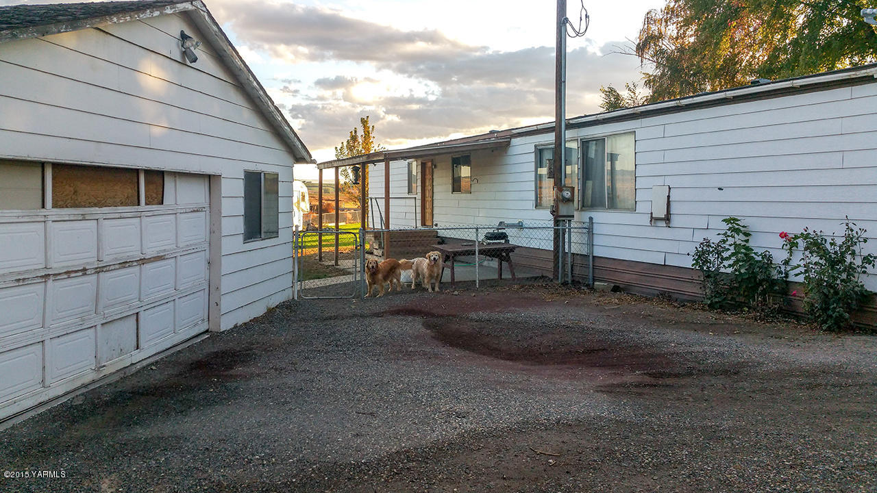 931 Liberty Road Outlook, WA 98938 - Photo 10 of 12 a view of a house with backyard and sitting area