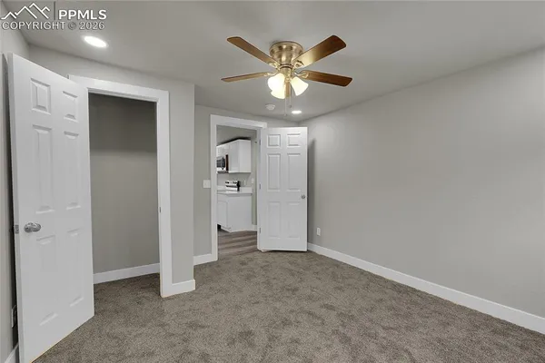 wooden floor in an empty room and a window