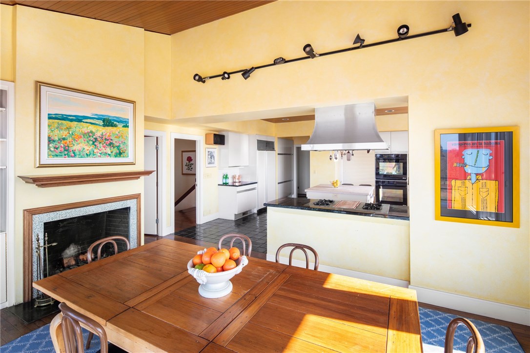 60 Beacon Hill Road Newport, RI 02840 - Photo 12 of 30 Open Kitchen and family room with one of four fireplaces throughout the house.