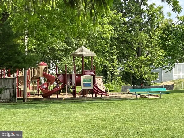 a view of a park with a slide