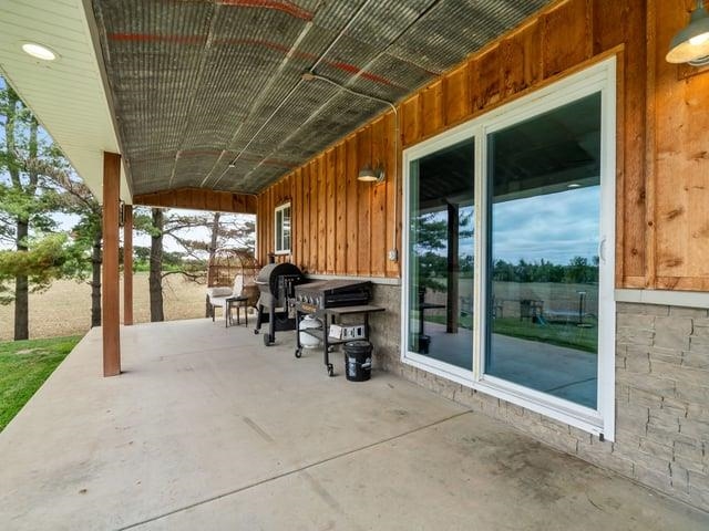 8294 North Leaf River Road Leaf River, IL 61047 - Photo 54 of 56 a view of a porch with chairs