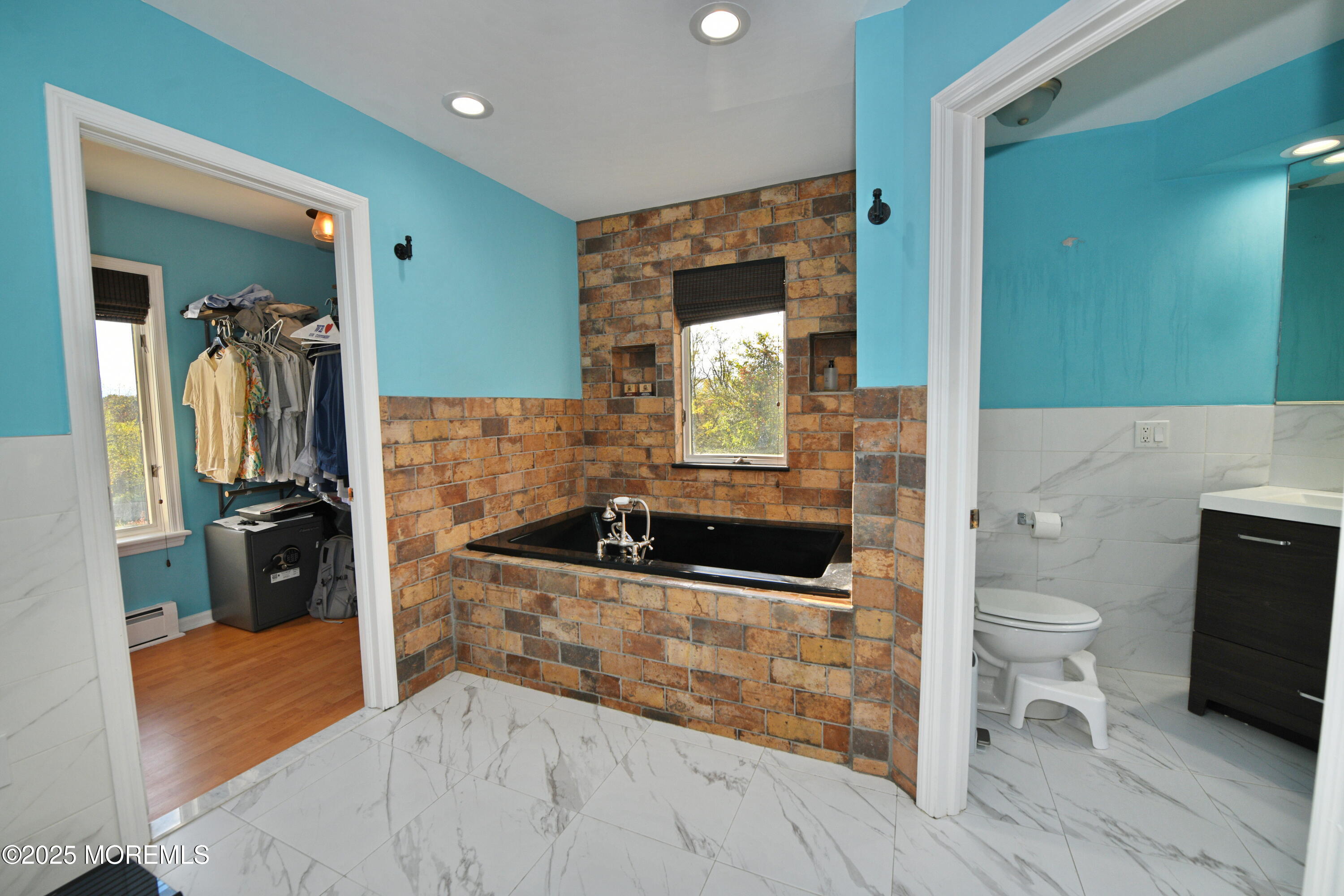 2262 Allenwood Road Allenwood, NJ 08720 - Photo 14 of 21 a bathroom with a sink a toilet and a mirror