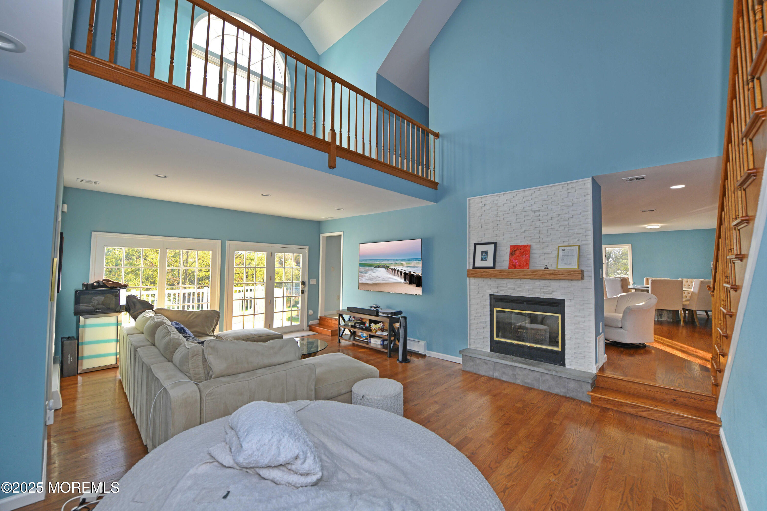 2262 Allenwood Road Allenwood, NJ 08720 - Photo 7 of 21 a living room with furniture a fireplace and a flat screen tv