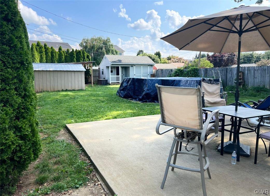 46 East Federal Street Allentown, PA 18103 - Photo 4 of 14 a view of a table and chairs under an umbrella in backyard