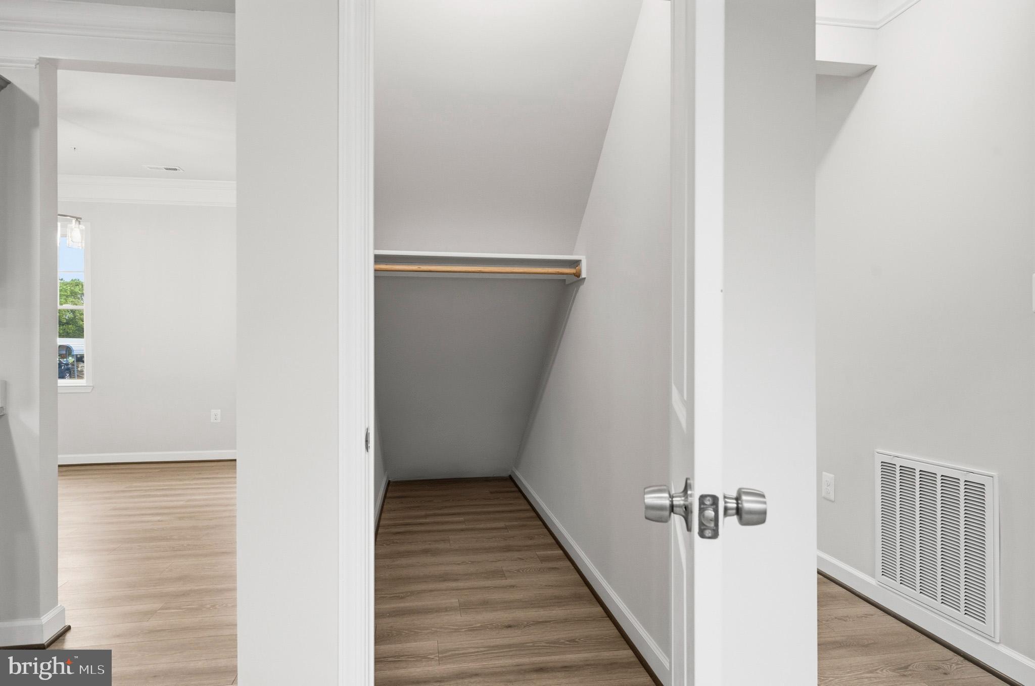 29725 Bruce Road Mechanicsville, MD 20659 - Photo 53 of 79 a view of a hallway with wooden floor and staircase