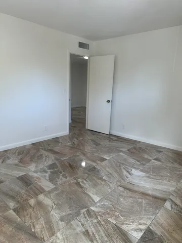 a bathroom with a sink toilet and a mirror