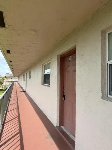 a view of balcony with wooden floor