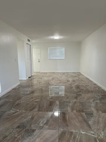 a view of an empty room and window