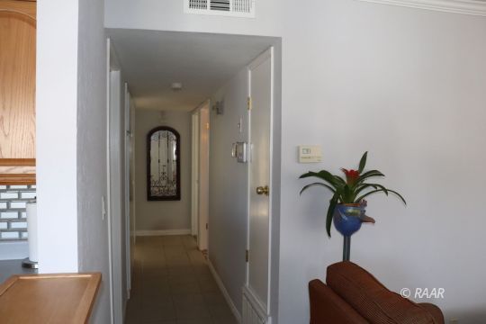 318 South Gordon Street Ridgecrest, CA 93555 - Photo 20 of 27 a vase of flowers sitting on a table in a bathroom