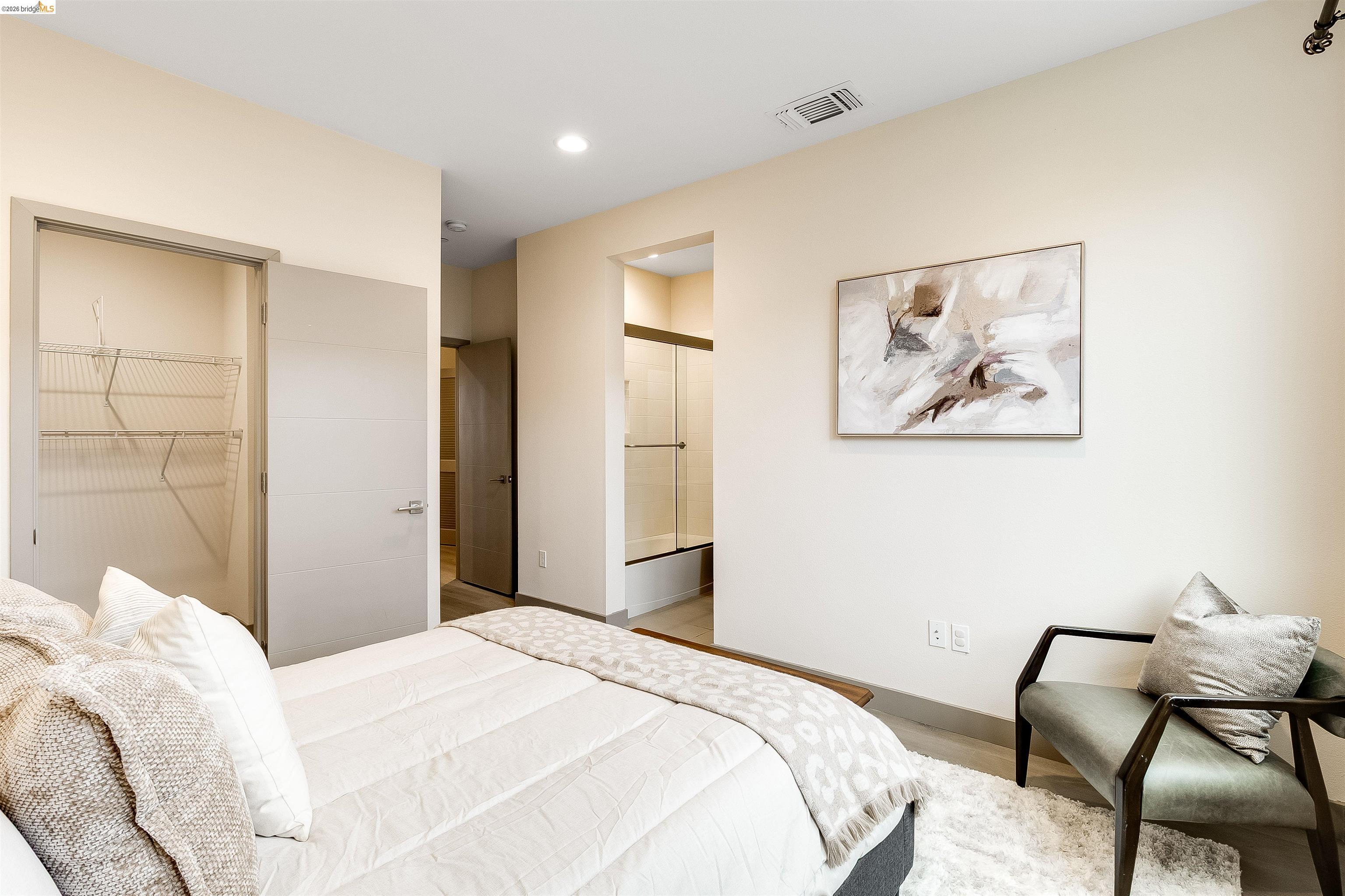 1357 Pullman Way Oakland, CA 94607 - Photo 29 of 37 Recessed lighting illuminates the neutral wall tones and wood-finish flooring