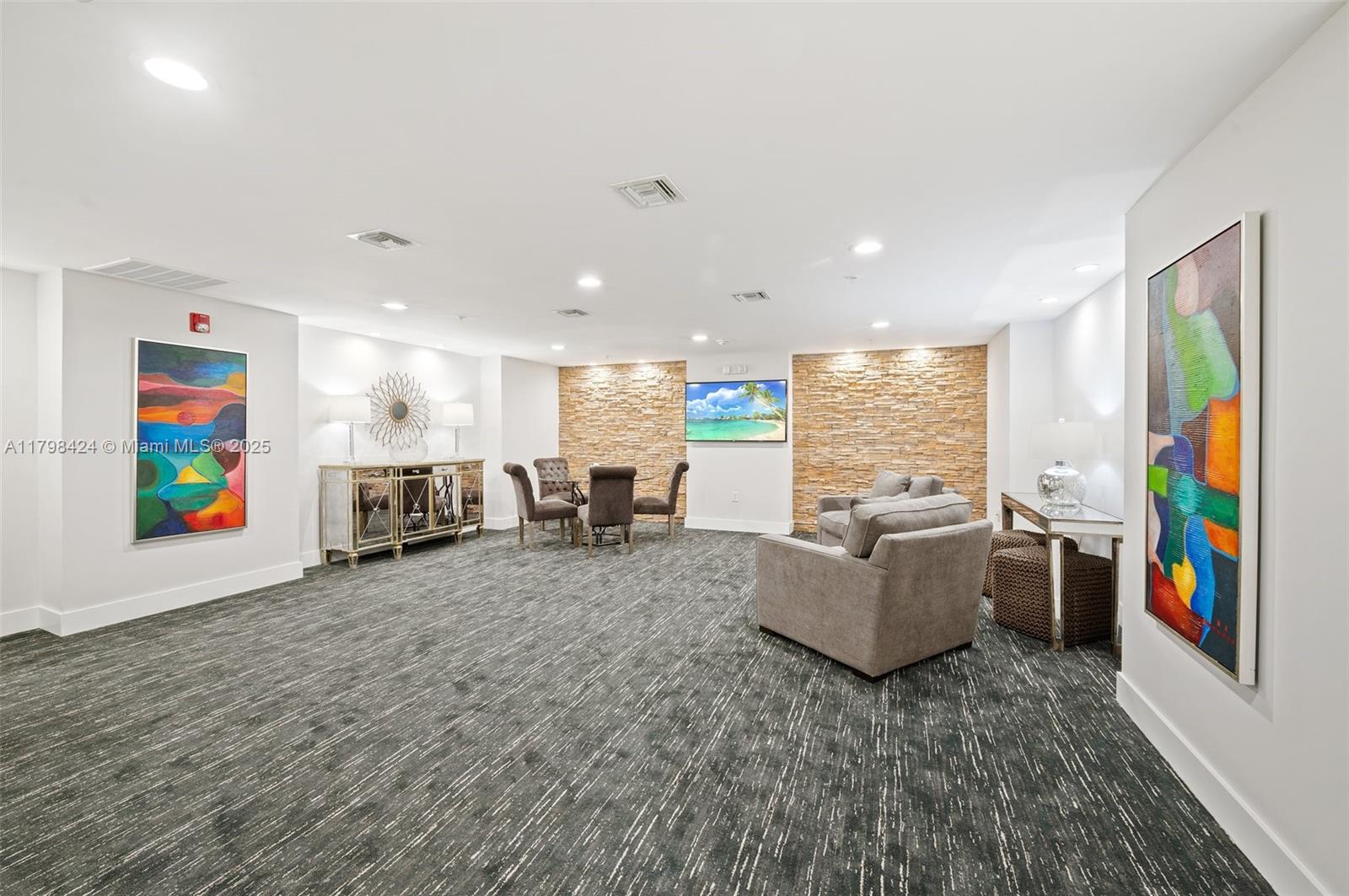 3530 Southwest 22nd Street, Unit 614 Miami, FL 33145 - Photo 9 of 20 a living room with furniture and a flat screen tv